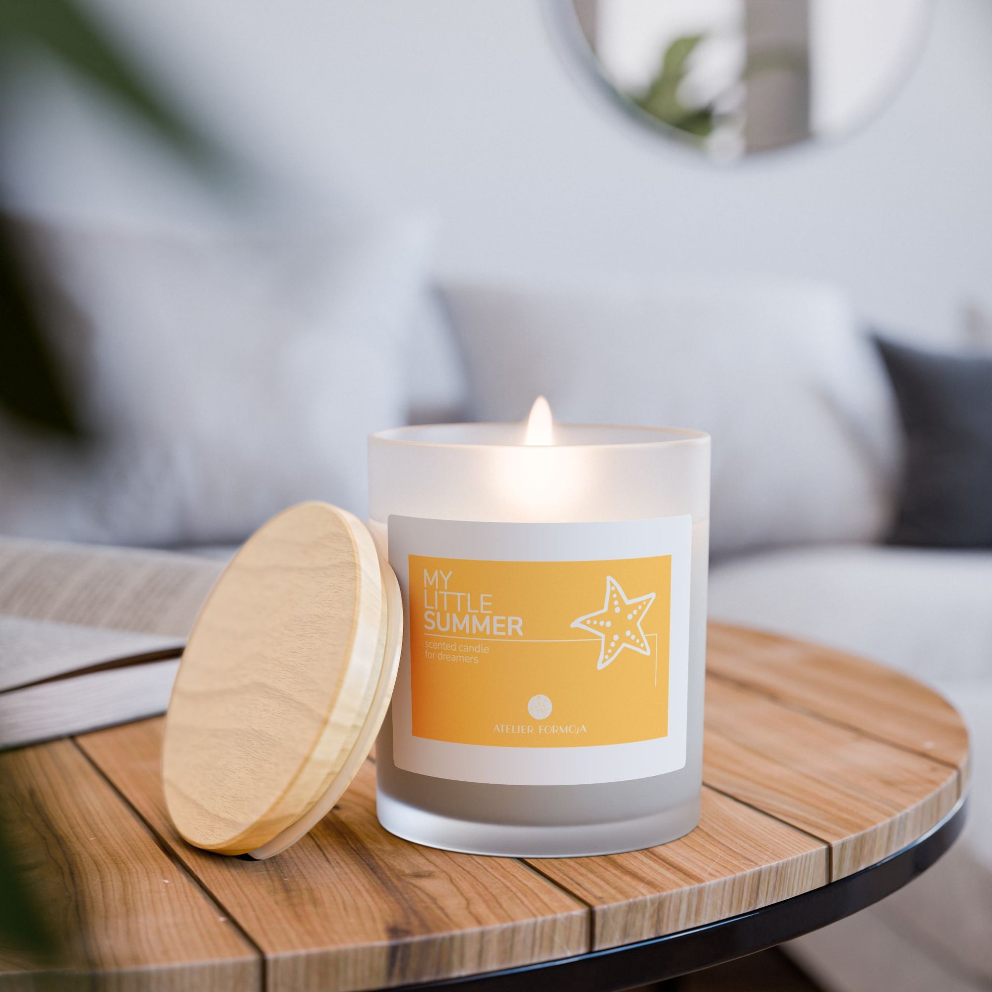 Yellow My Little Summer candle by Atelier Formosa with starfish illustration and wooden lid.