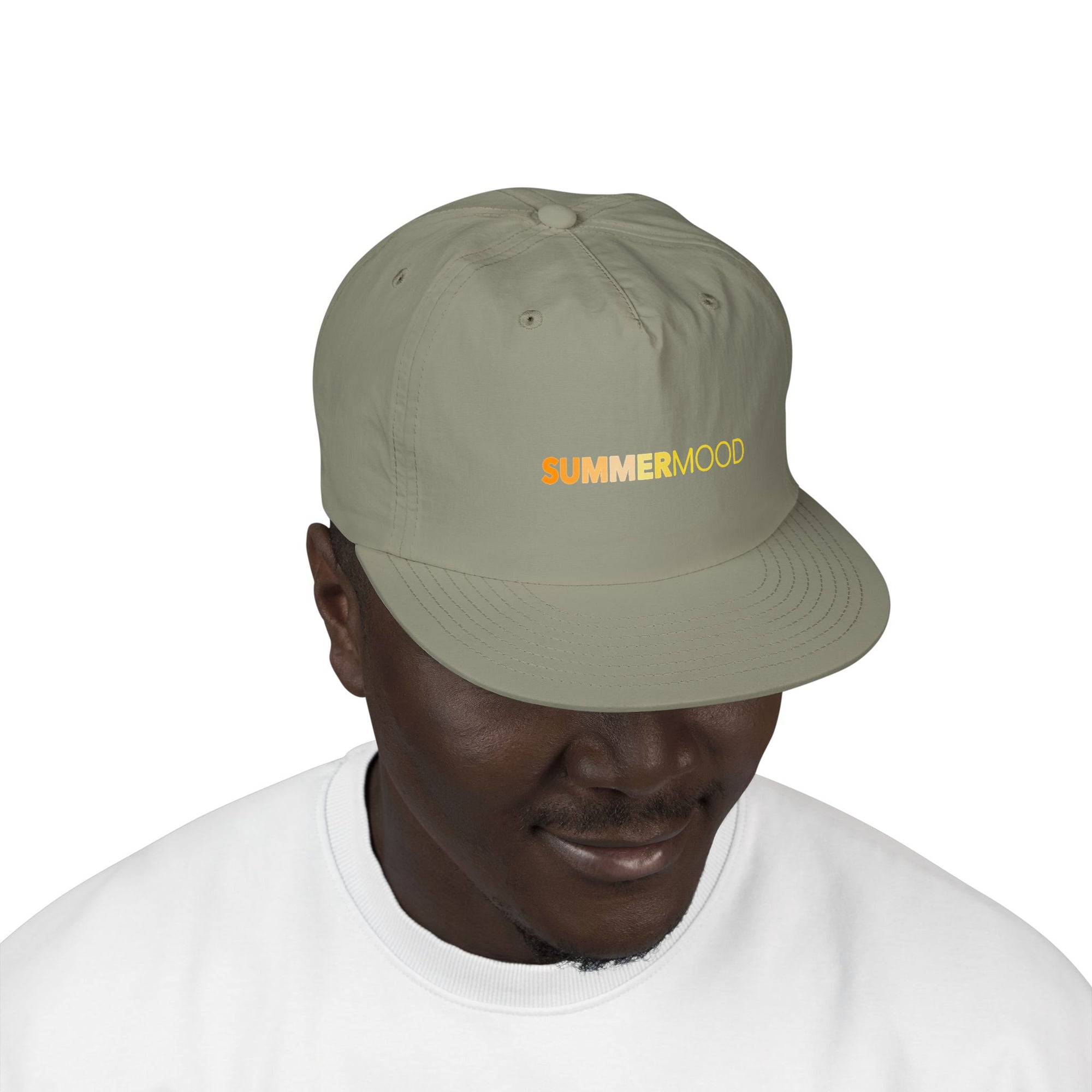 Wear green cap featuring embroidered “SUMMERMOOD” text in yellow and orange gradient, perfect for sunny adventures.