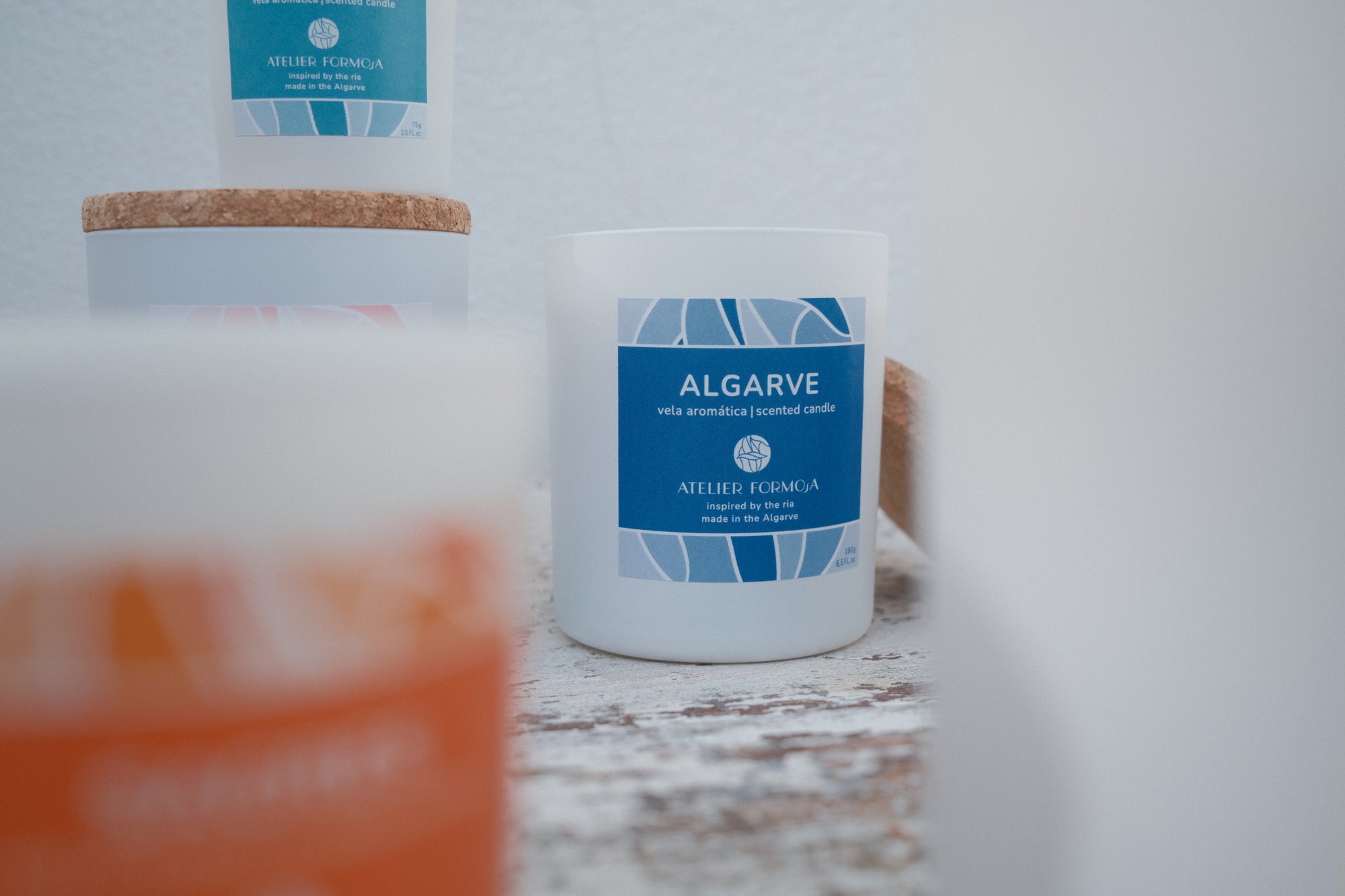 Blue-themed Algarve candle inspired by the Portuguese coast, styled for a beachy summer vibe.
